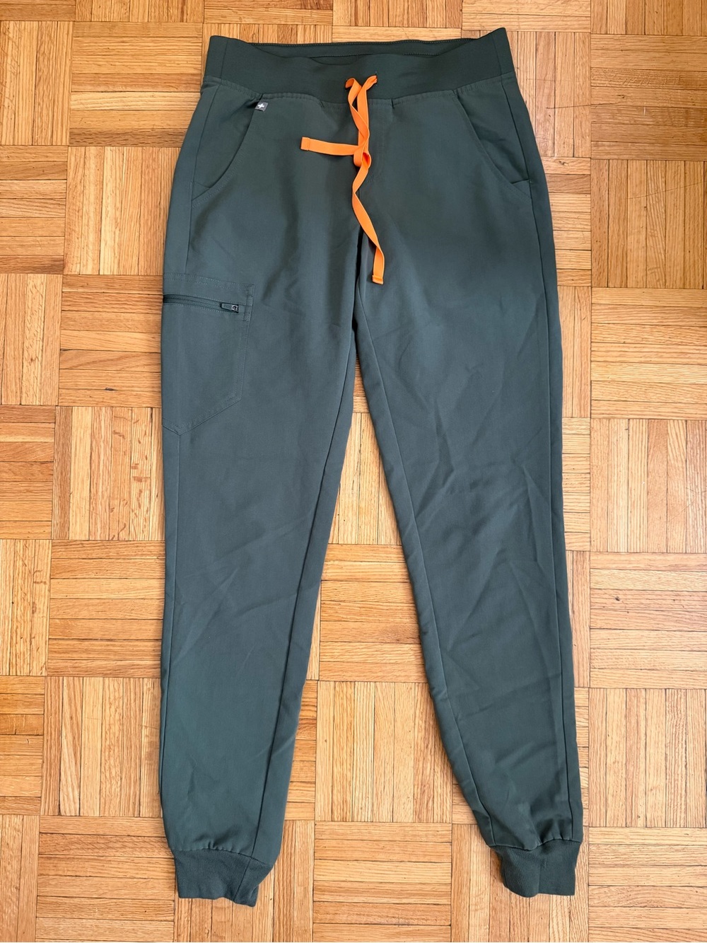 FIGS Women's Zamora Jogger Scrub Pants in the color Moss Green